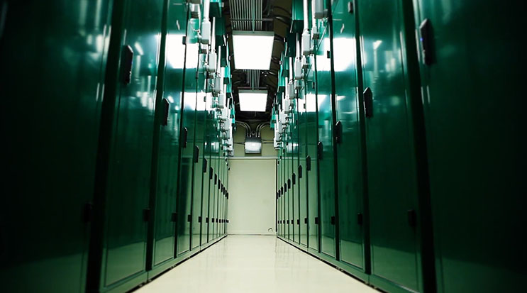 An aisle inside a ScaleMatric data center, with its custom containment colo cabinets. (Image: ScaleMatrix)